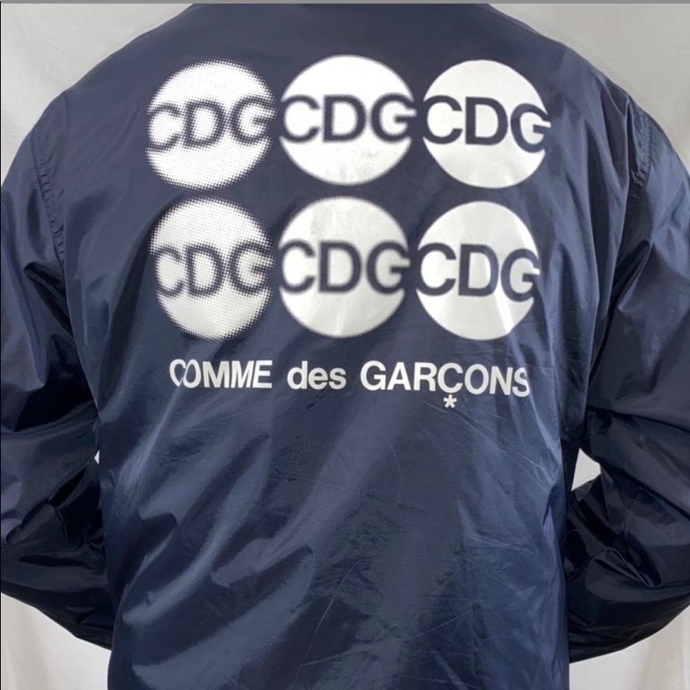 CDG jacket with small white speck in front